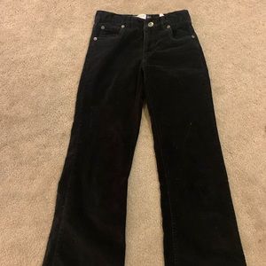 Black corduroy bootcut jeans.